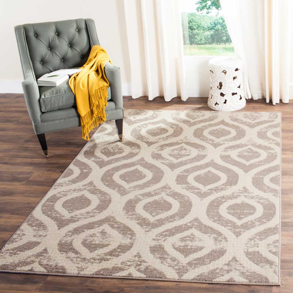 An ivory rug with muted mauve ogee motifs adds warm pattern to a cozy seating space