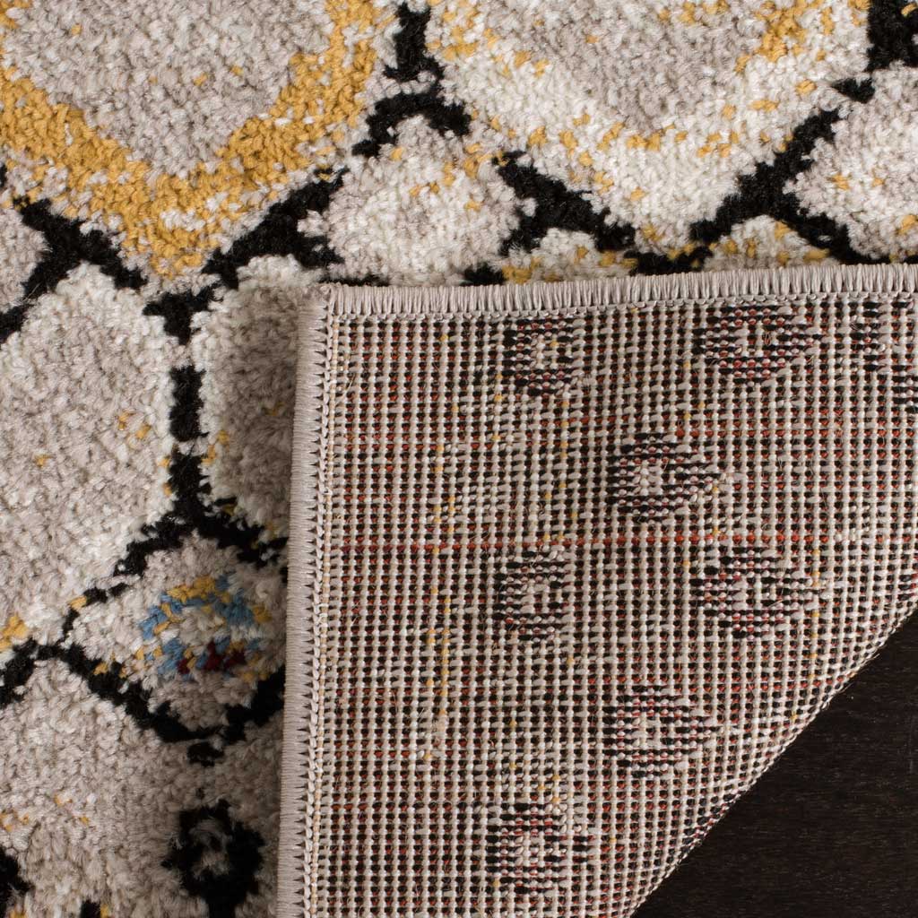 Woven jute backing and a bound edge support the light gray rug's colorful geometric pile