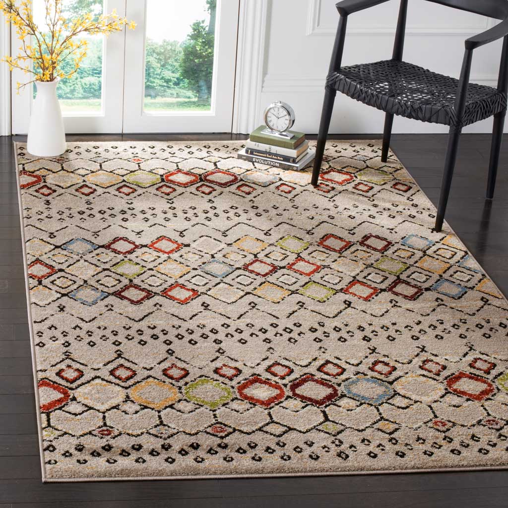 Light gray rug adds lively diamond bands to a modern sitting area with dark furnishings