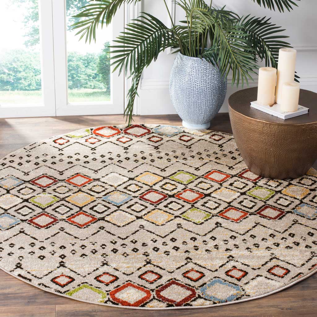 Multicolor diamond bands brighten a round light gray rug with an airy geometric look