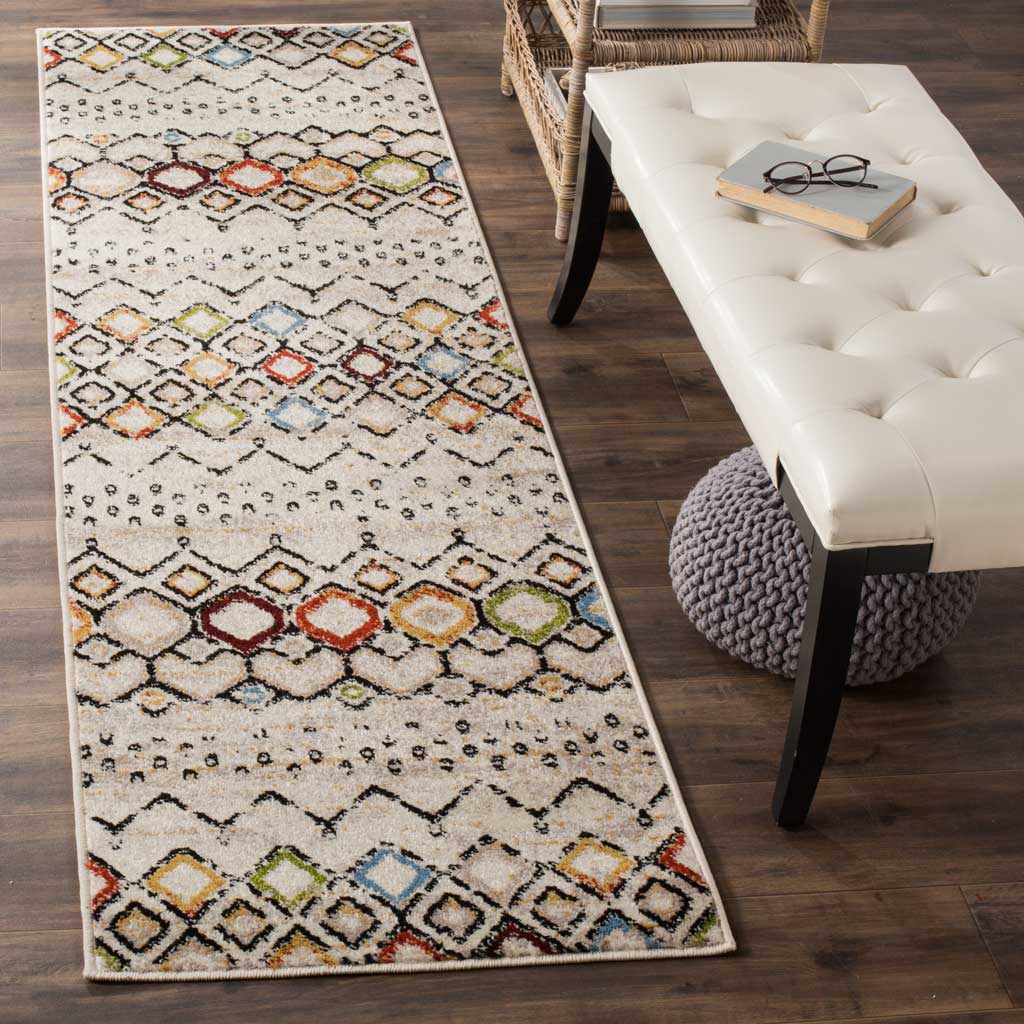 Colorful diamonds lend a lively bohemian touch to this ivory runner rug.