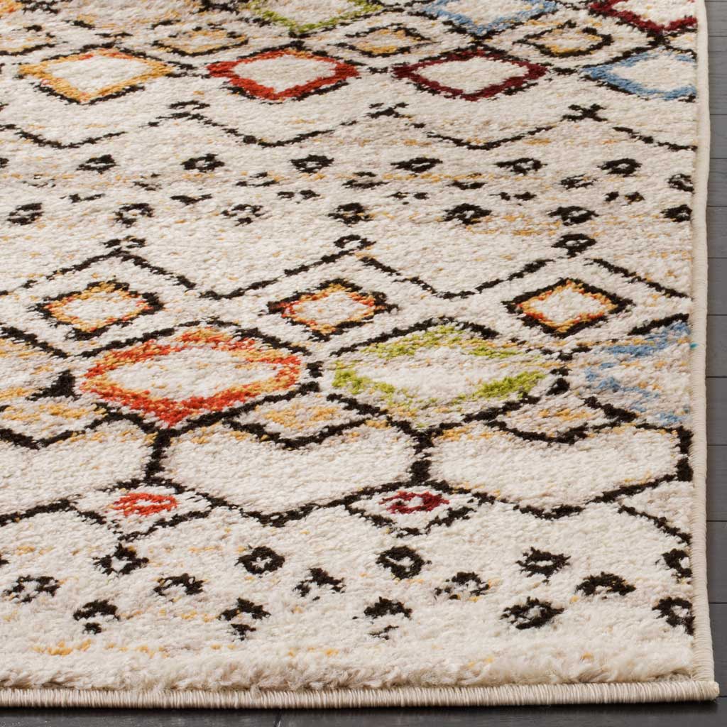 Soft ivory pile highlights colorful diamonds and a neatly bound rug edge