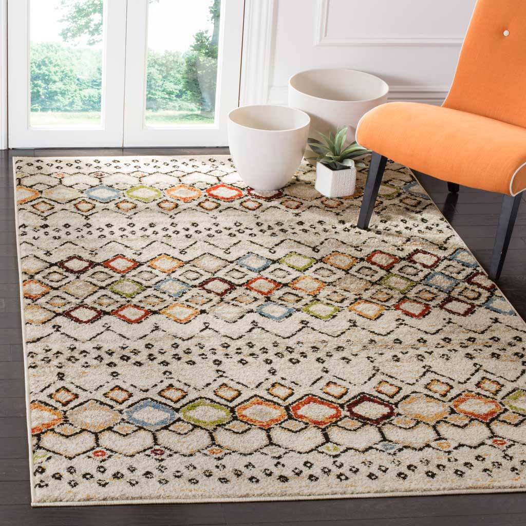 Colorful diamond bands brighten the ivory rug beneath a vibrant orange chair