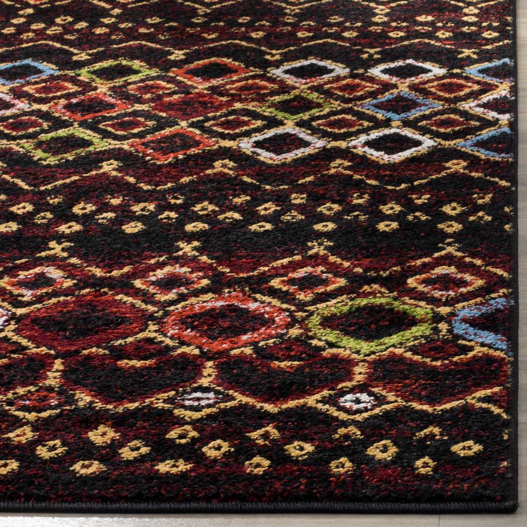 Vibrant diamonds meet a neatly bound edge on the black rug's textured, low-profile pile