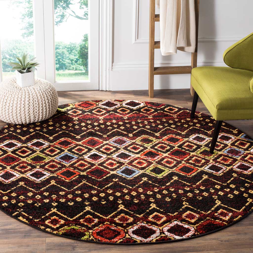 A dark round rug adds bold diamond patterns and warm color to a seating area