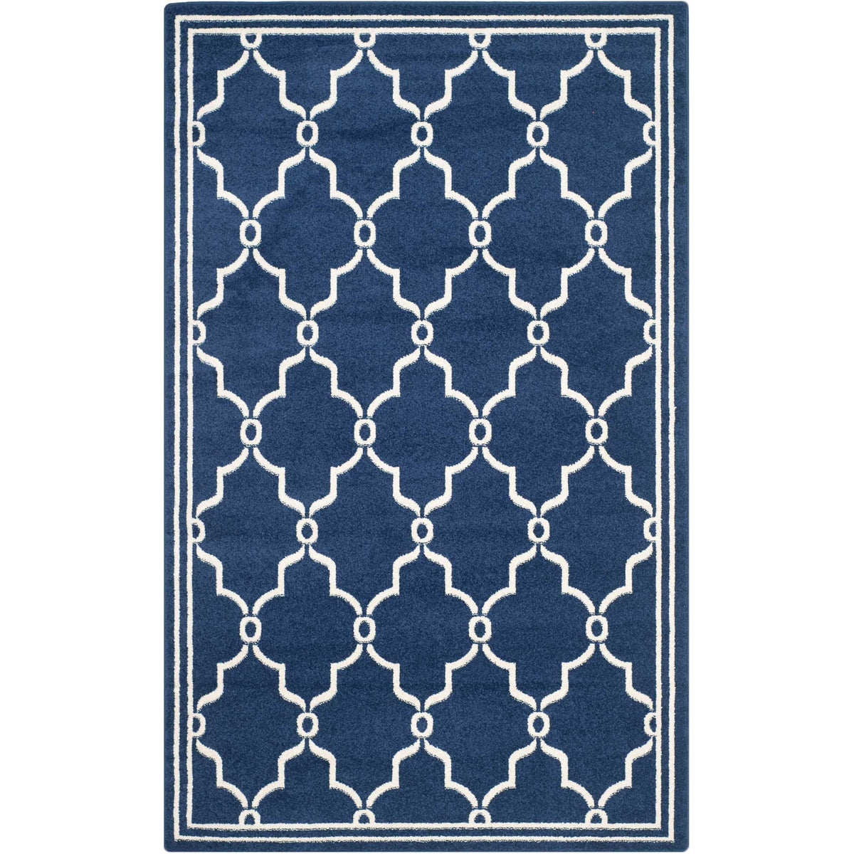 Navy area rug pairs an open beige trellis with a neatly framed rectangular shape