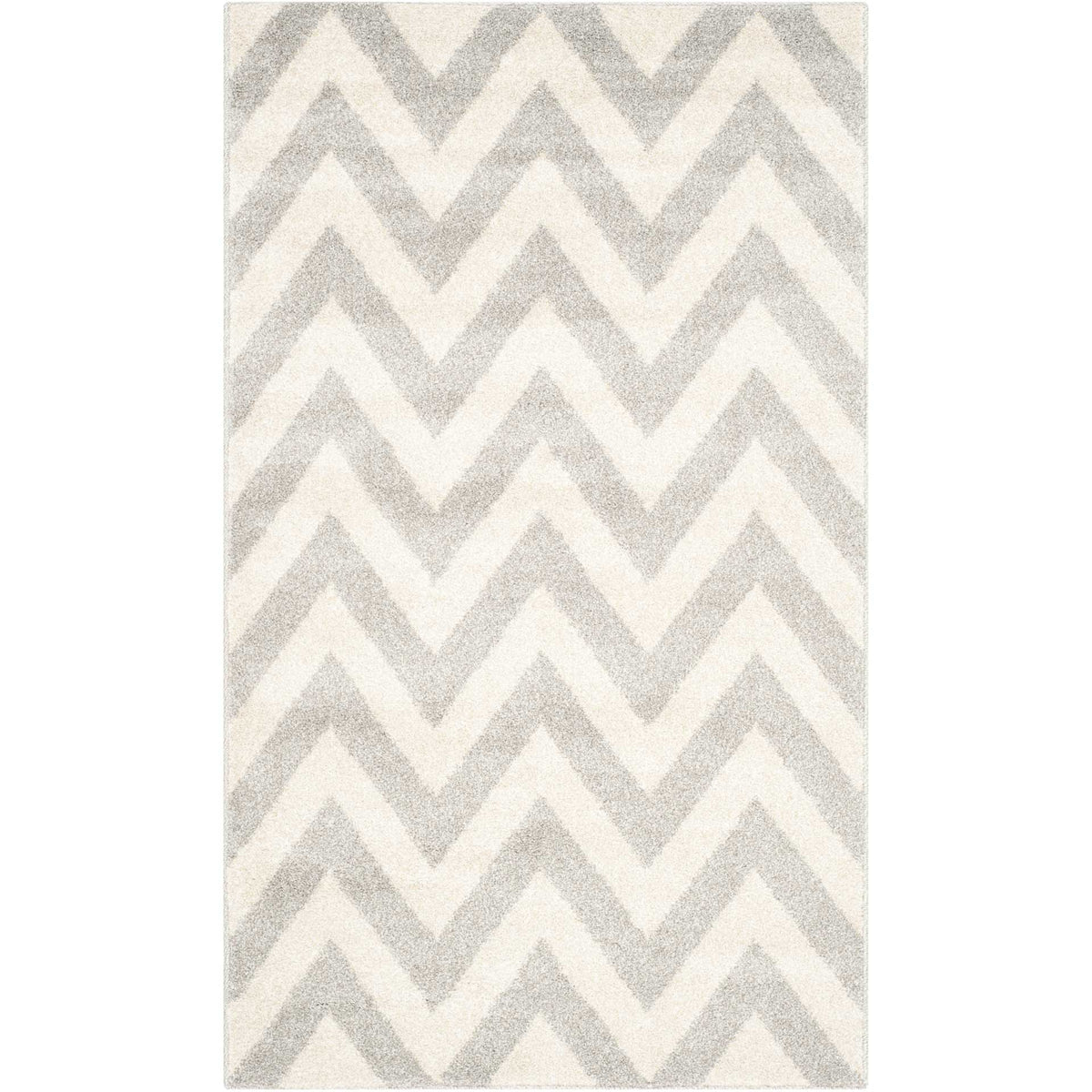 Soft gray zigzags give this small beige rug a gentle geometric accent.