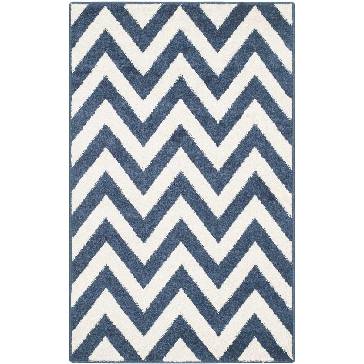 A compact navy and beige accent rug adds bold zigzag pattern to smaller spaces.