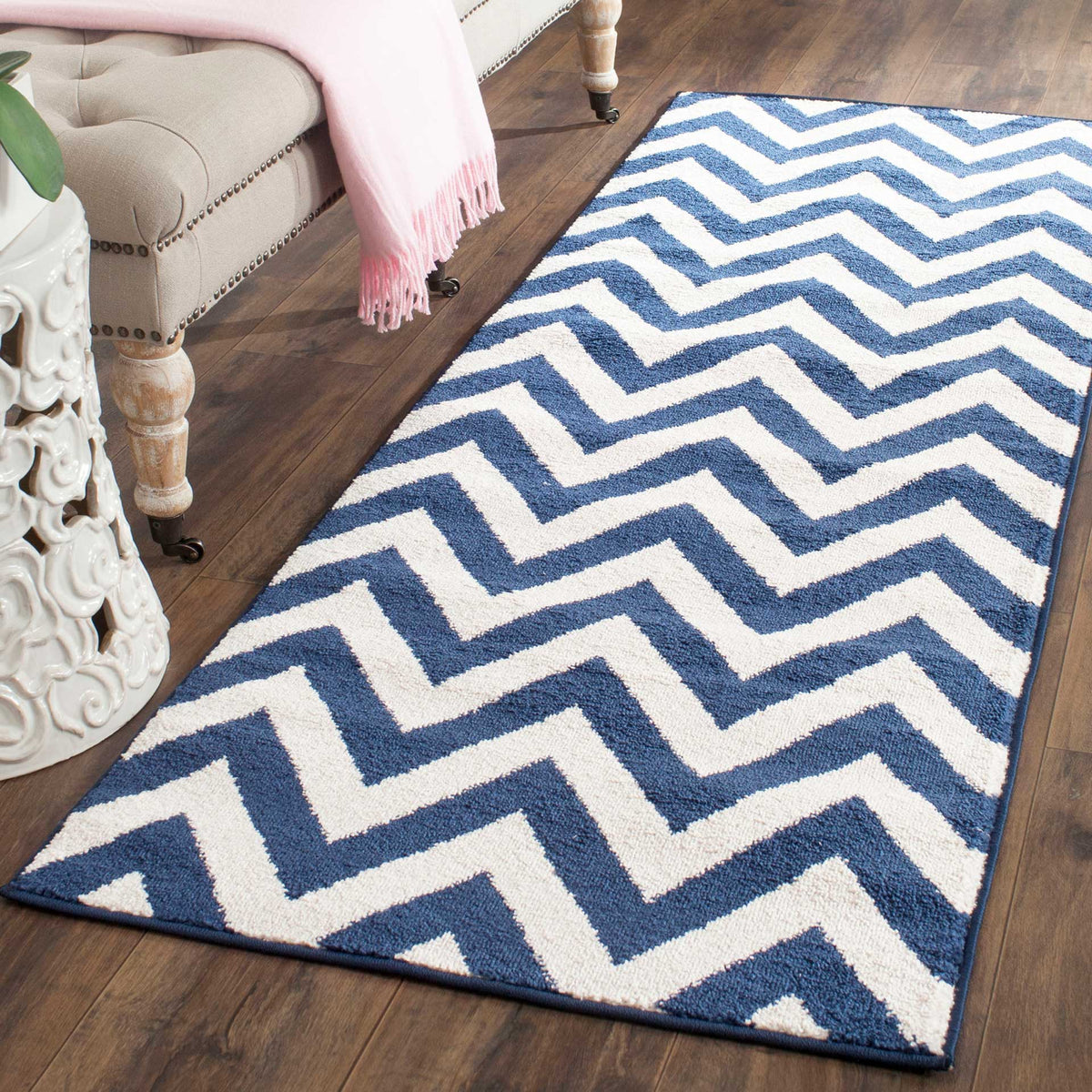 Graphic navy and beige zigzags give this runner striking contrast against wood flooring.