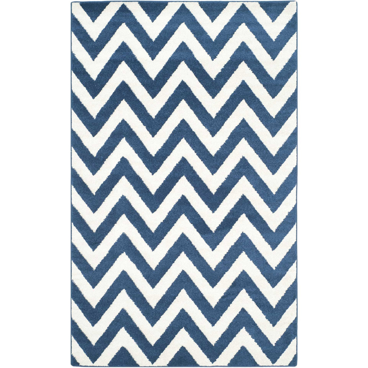 Broad navy zigzags stand out against beige on a rectangular rug with a soft, textured finish.