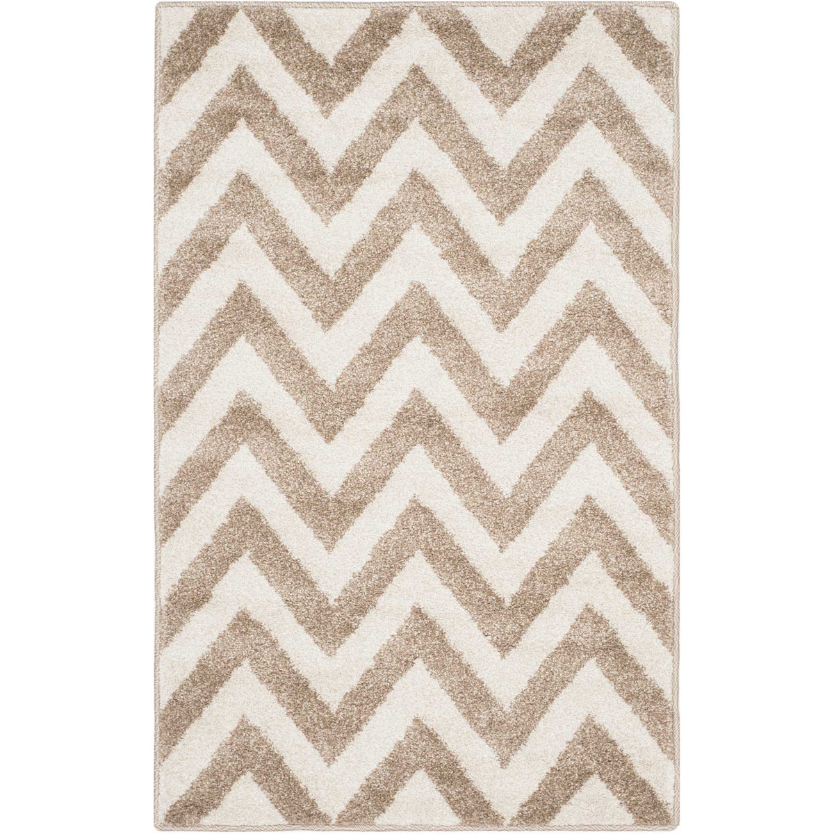 A compact wheat and beige rug brings bold zigzag texture to a small space.