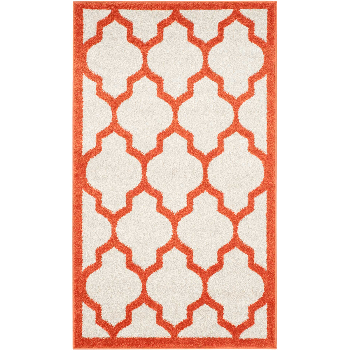 Compact beige accent rug with oversized orange quatrefoils and a bold border