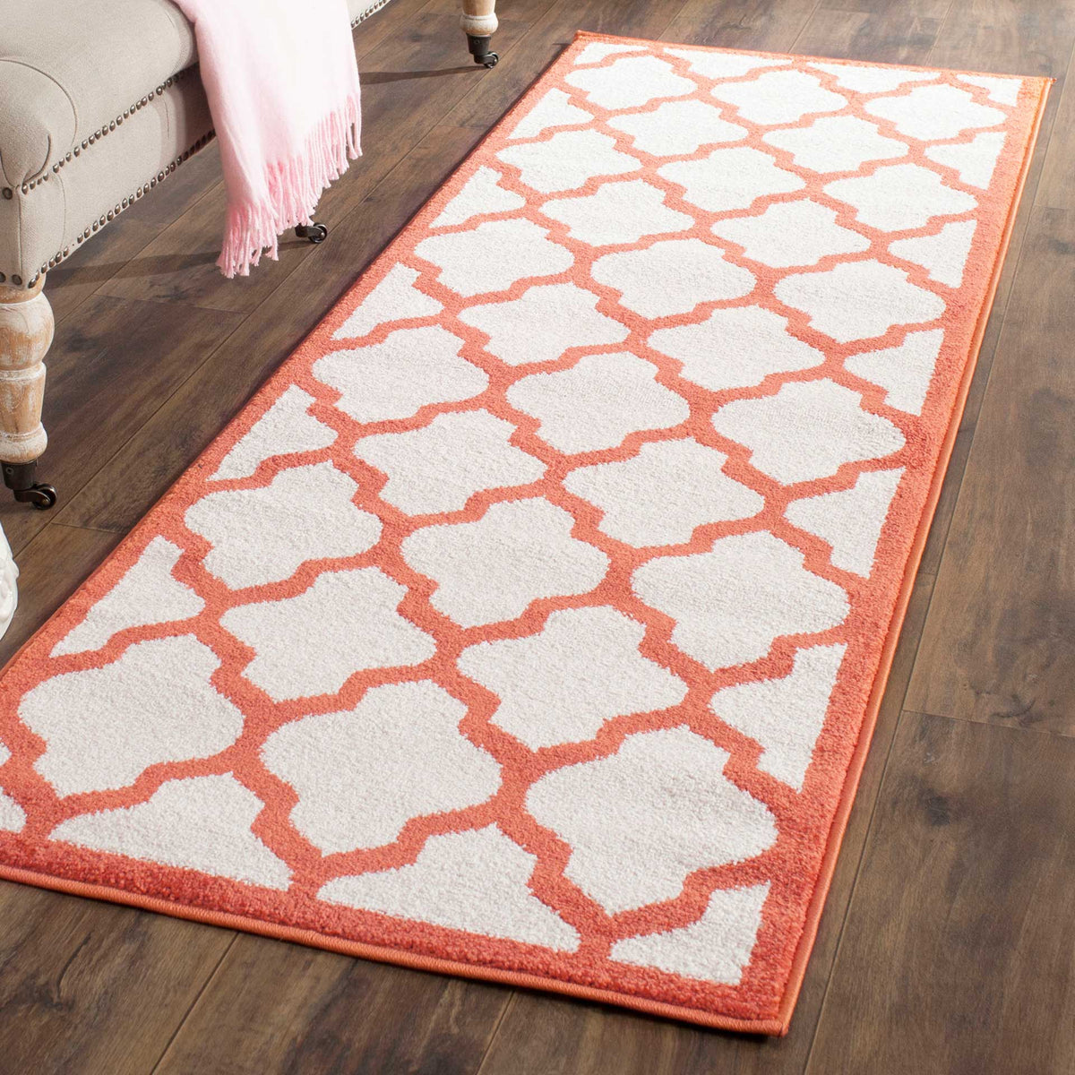 Warm orange latticework brightens this soft beige runner rug