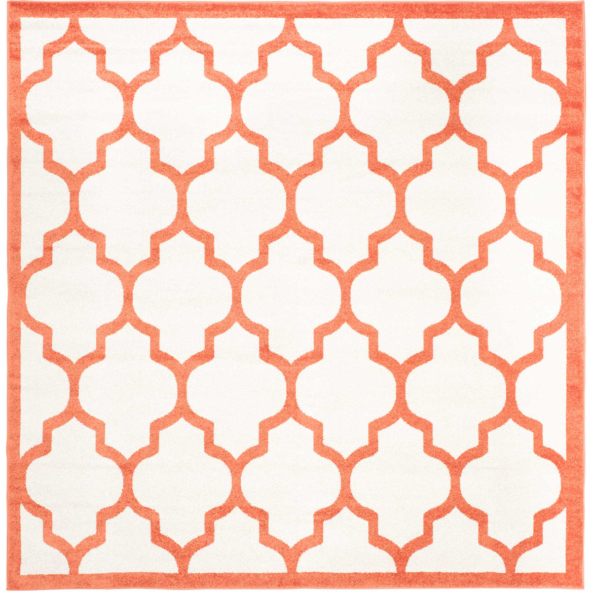 Square beige rug with orange latticework extending to a bold border