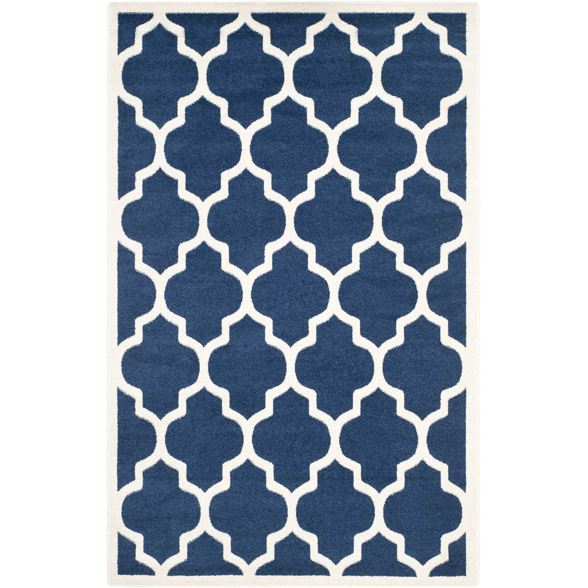 Navy rectangular rug with a repeating beige quatrefoil pattern and framed edge
