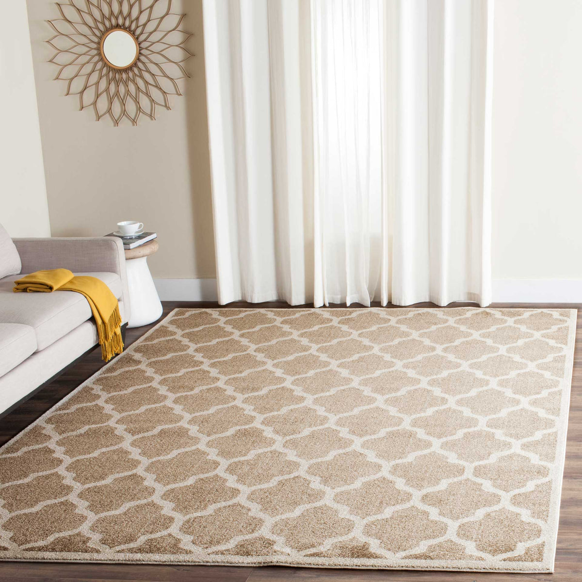 Wheat and beige trellis rug gives a bright living room a warm patterned foundation