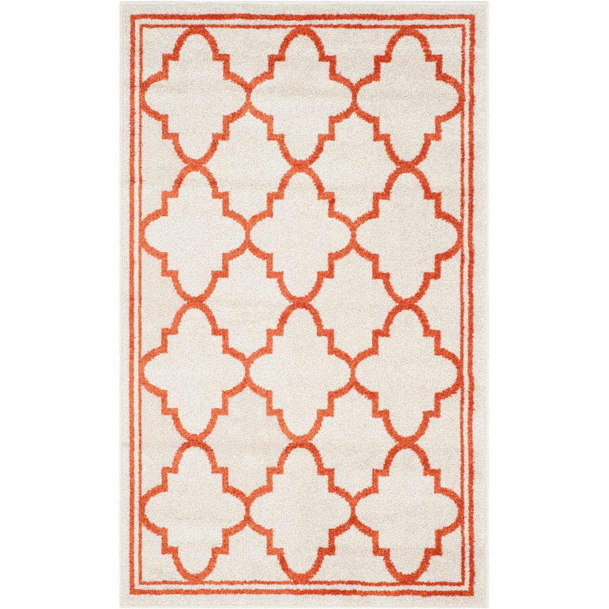 Bold orange latticework frames beige quatrefoils on this 2 ft. 6 in. by 4 ft. accent rug.