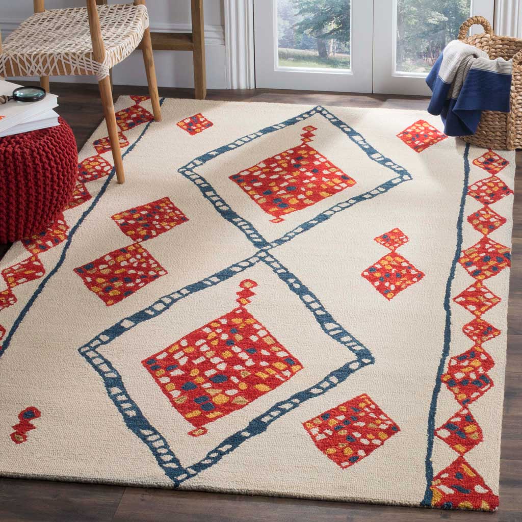 Ivory wool rug warms the room with oversized red diamonds, blue lattice outlines, and patterned side borders.