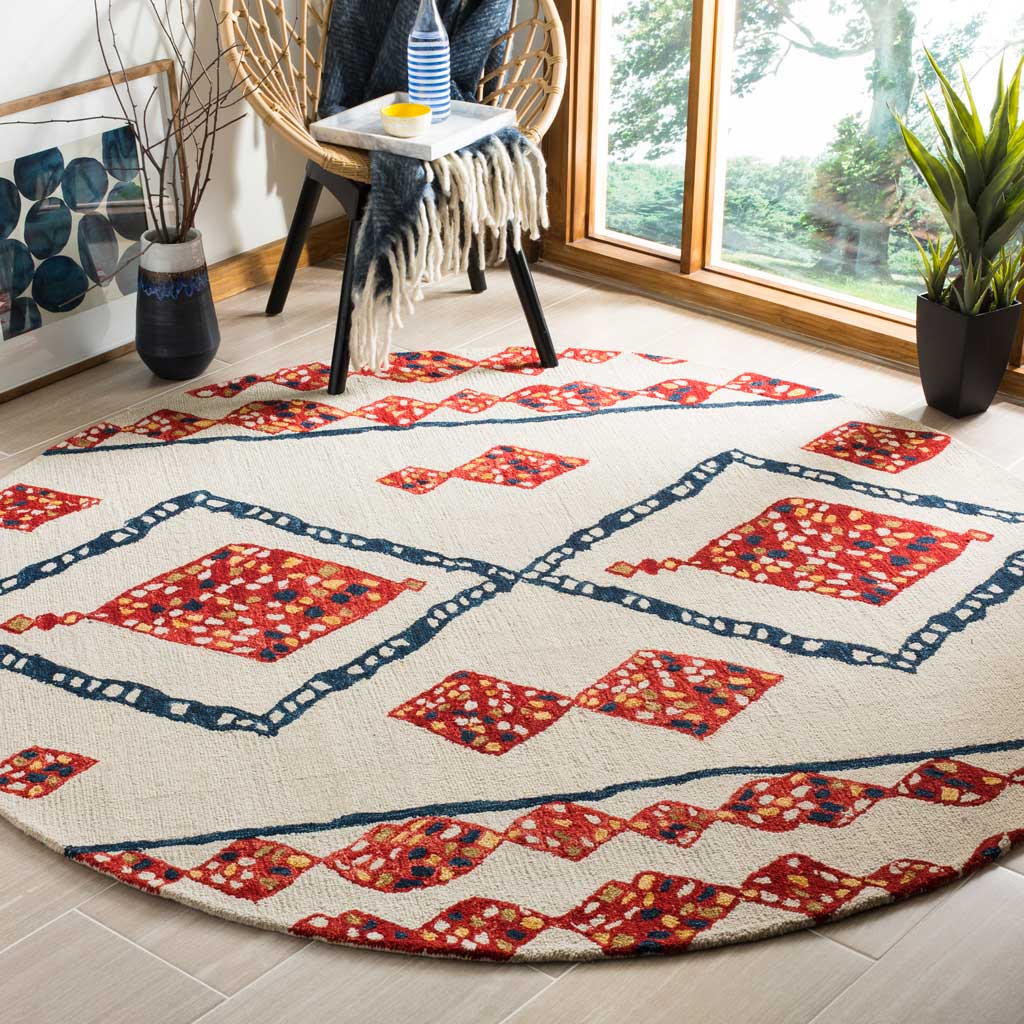 A round ivory rug with colorful diamond motifs adds warmth beneath a woven chair