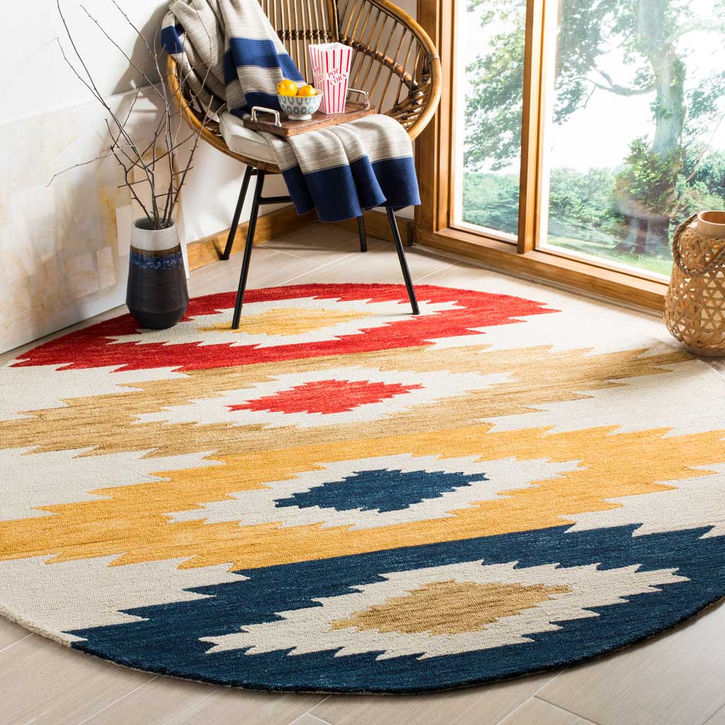 Colorful geometric motifs bring warmth and contrast to the round rug beneath a lounge chair.