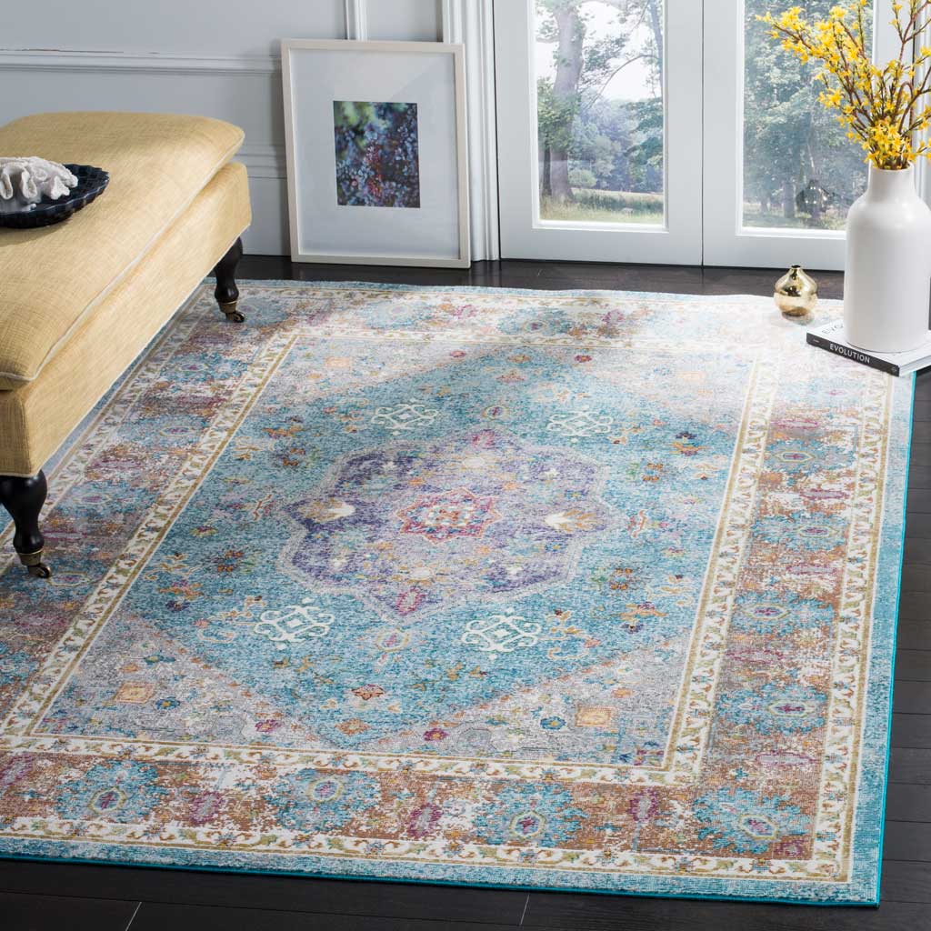 An ornate blue and cream medallion rug adds a soft wash of color to a bright living space.