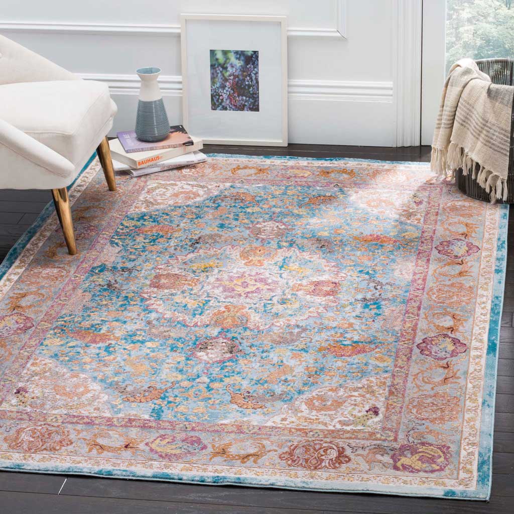 An ornate blue and orange rug brings colorful, traditional character to a living room.