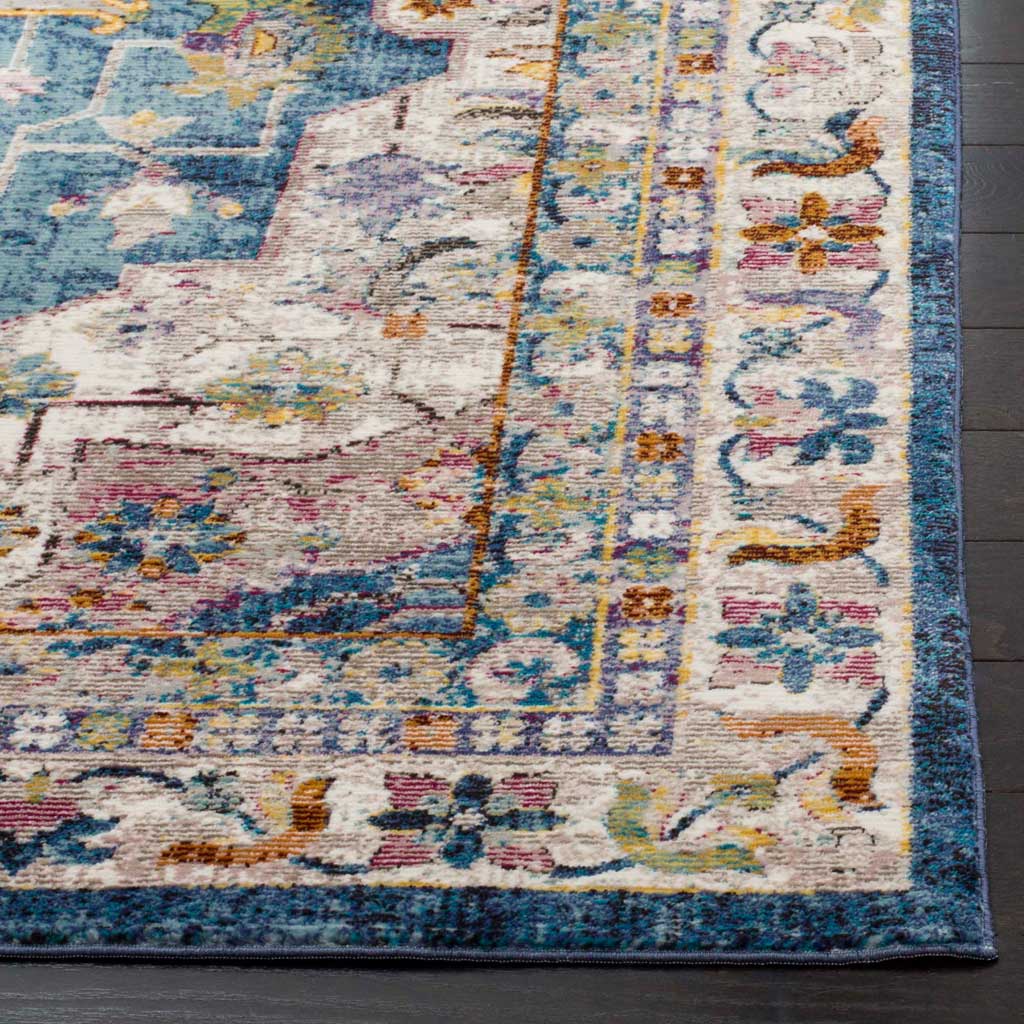 An inky blue edge highlights a cream border filled with colorful floral accents.