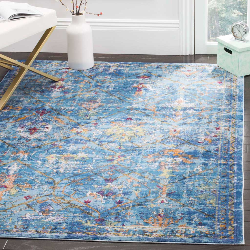 A vibrant blue floral rug with warm multicolor accents brightens a living space