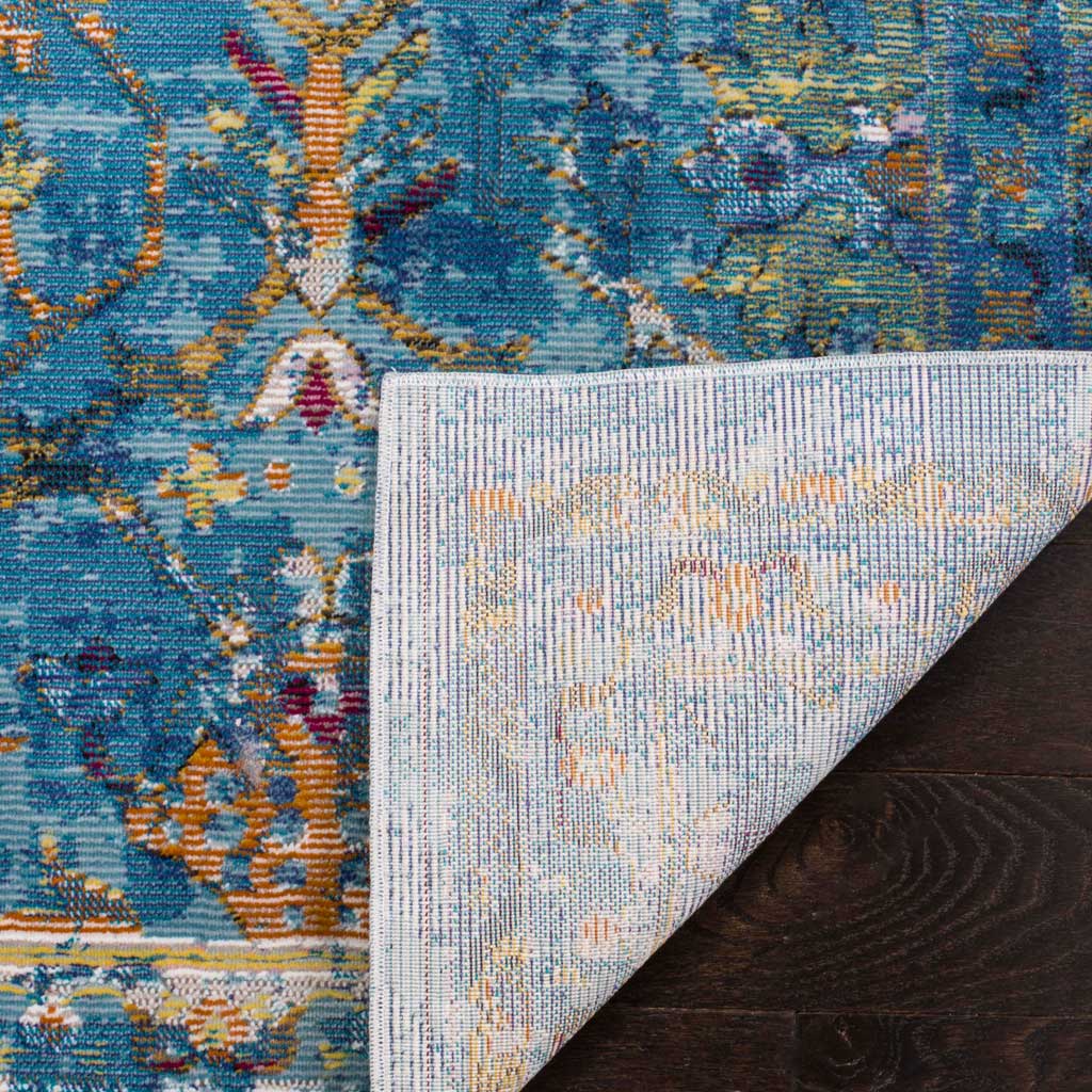 A light woven backing complements the colorful blue patterned pile