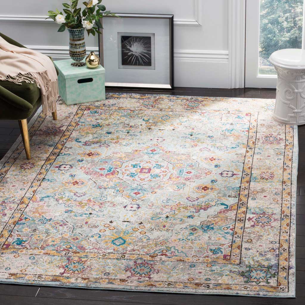 Soft beige and blue tones bring warmth to this medallion rug with an ornate floral border
