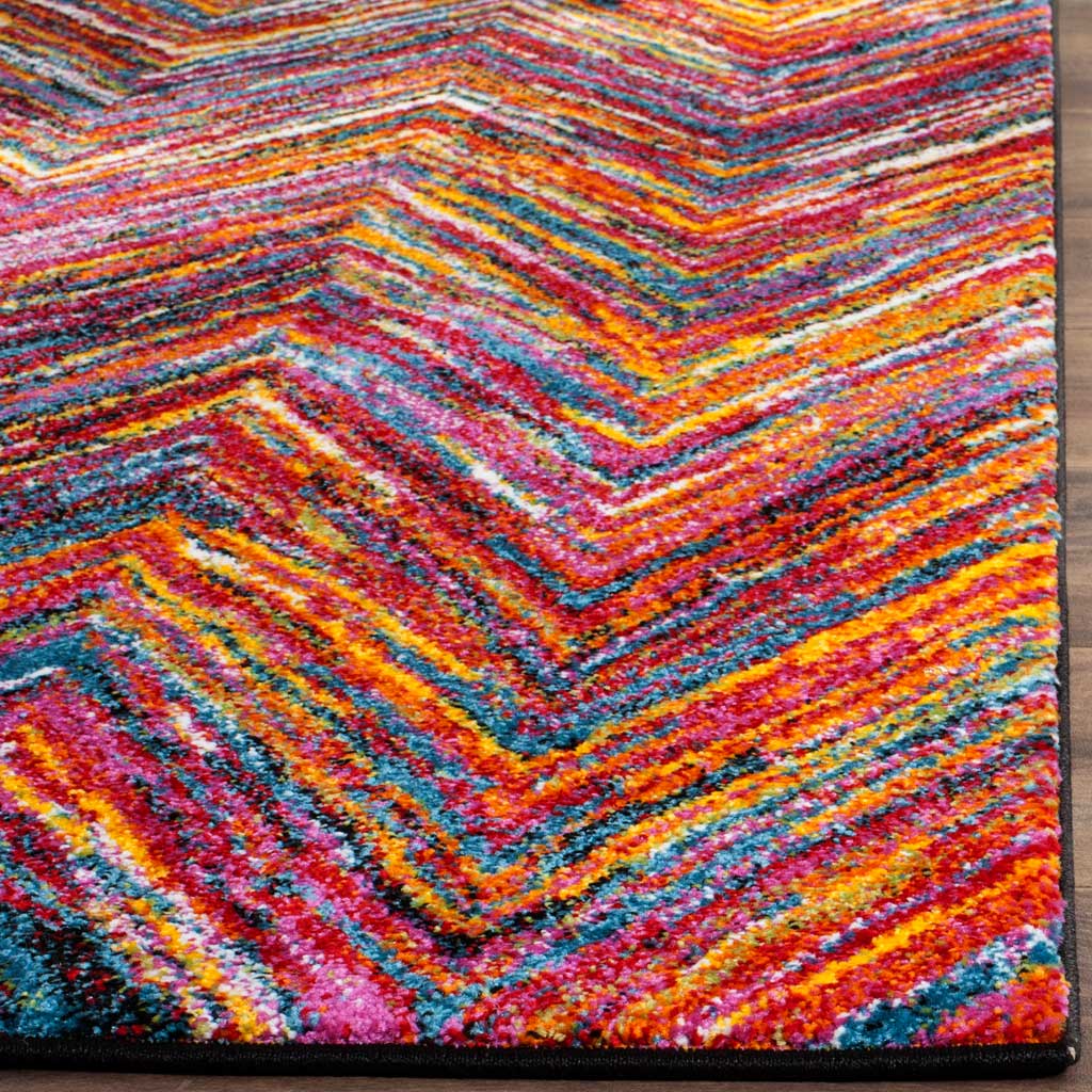 Bright chevron stripes and a dark bound edge showcase the rug's richly textured pile.
