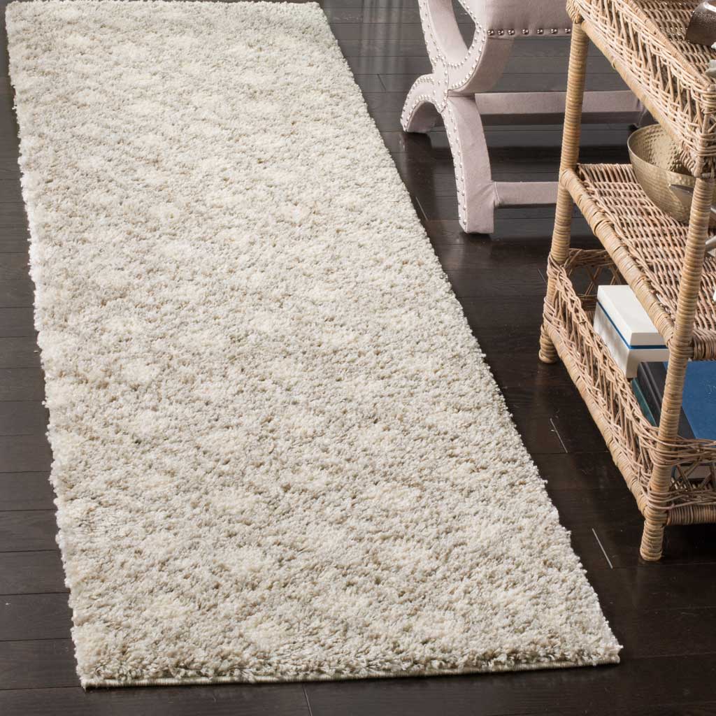 Dense ivory shag pile and understated beige markings create a soft, welcoming runner.