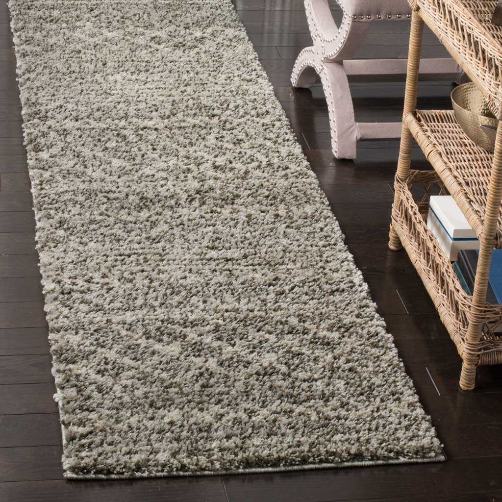 Dense brown and ivory fibers give this runner's banded geometric design a cozy feel.