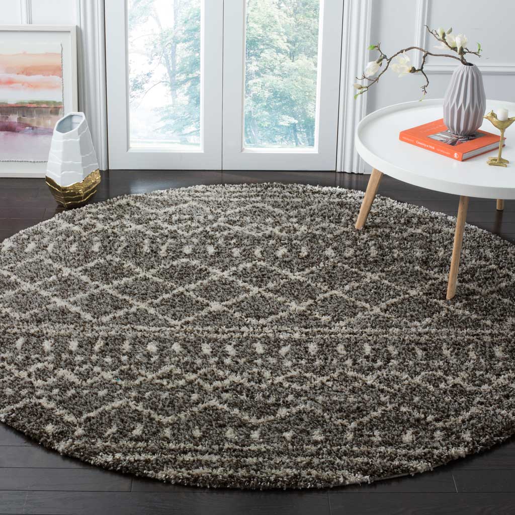 Bold diamond bands and soft brown shag bring warmth beneath an accent table