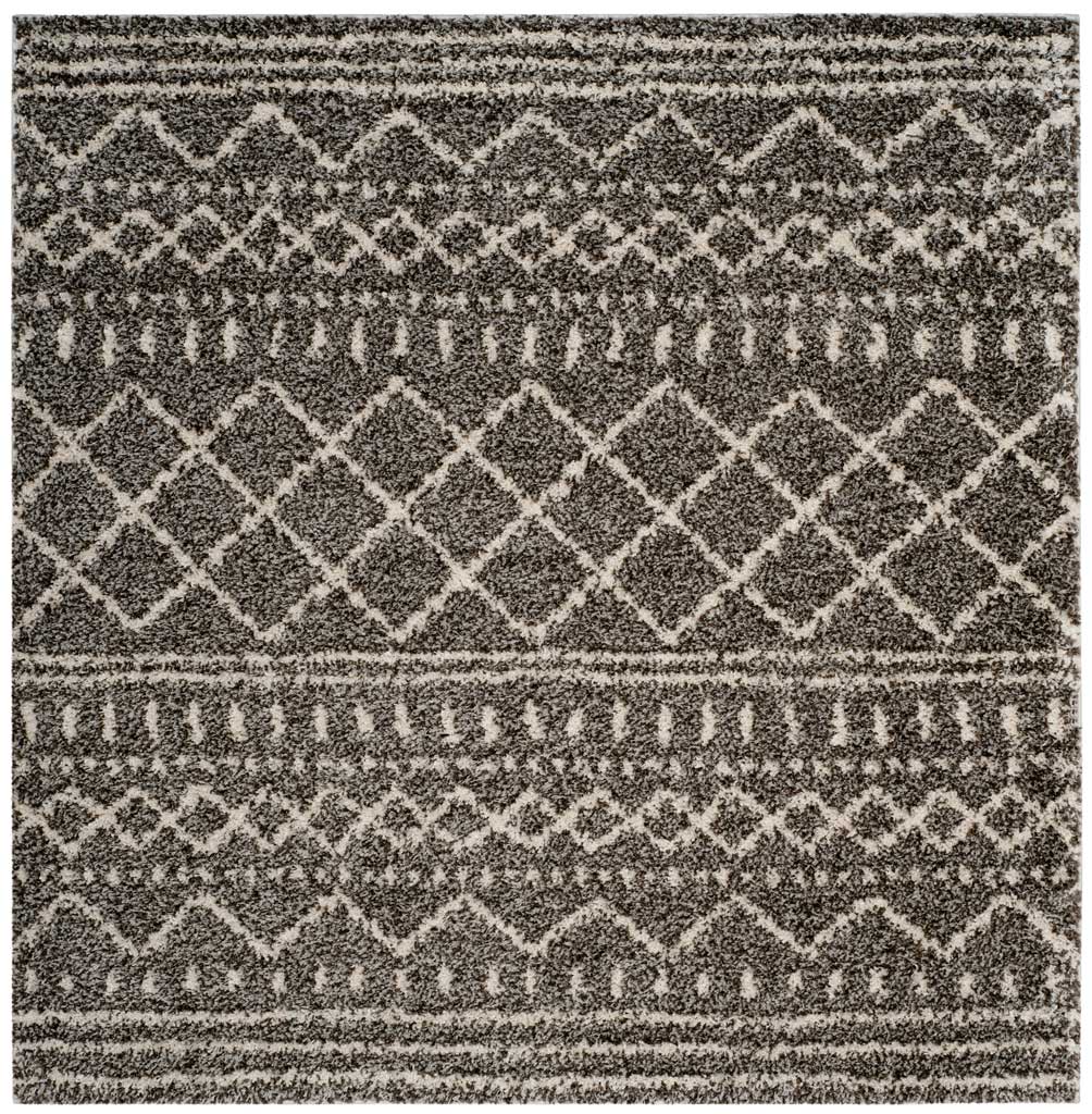 Square brown and ivory rug combines striped borders, zigzags, and rows of diamonds.