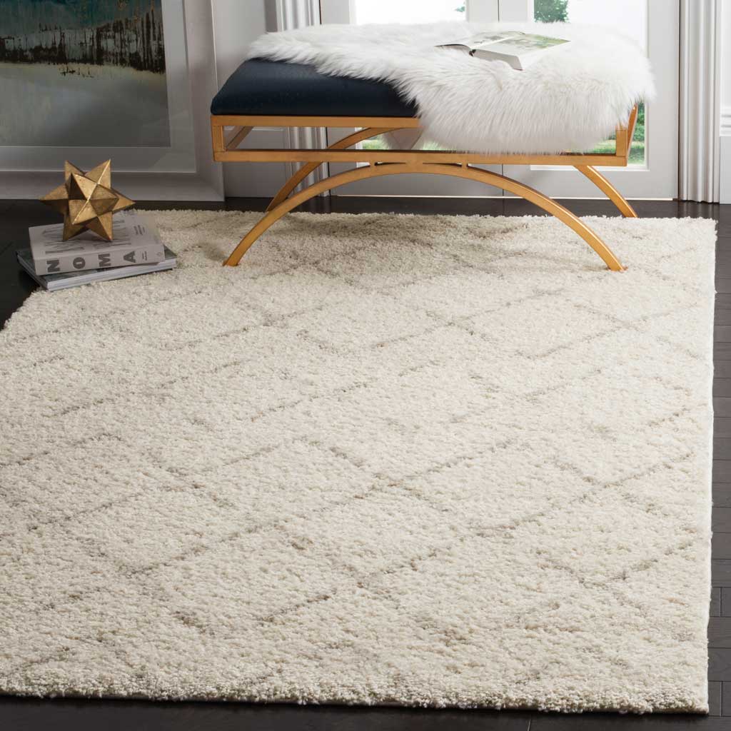 Ivory shag with understated beige diamonds brings warmth under a curved wood bench.