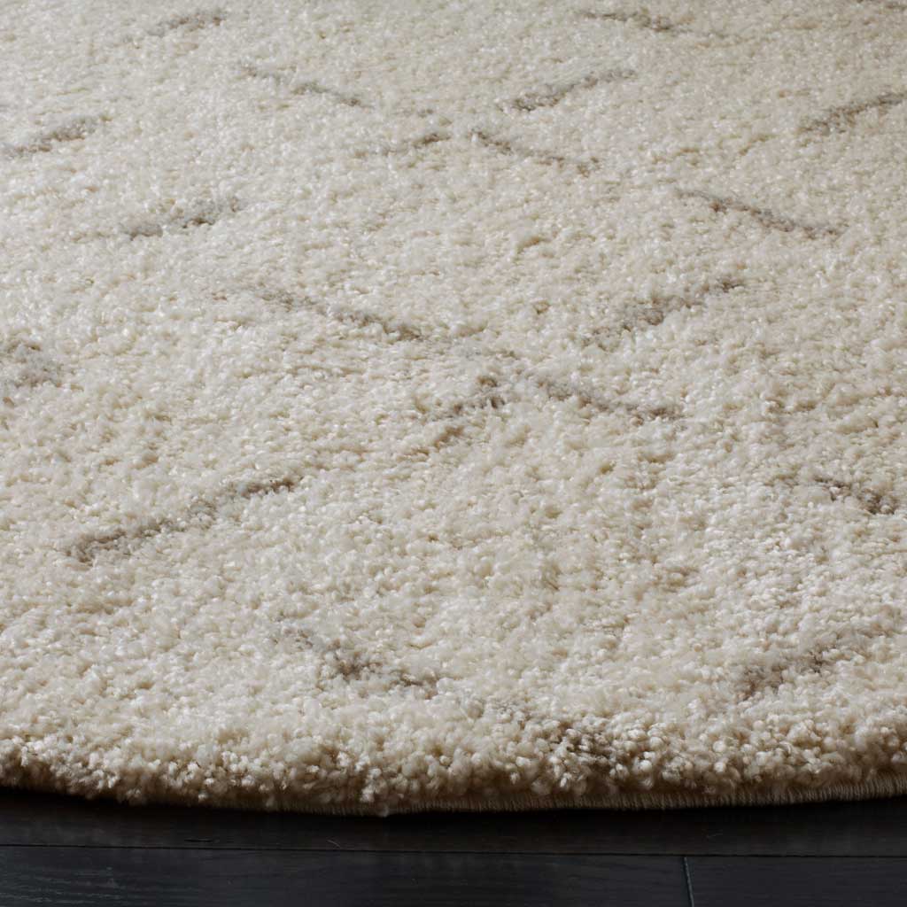 Plush ivory pile reveals fine beige lines and a full, cushioned edge