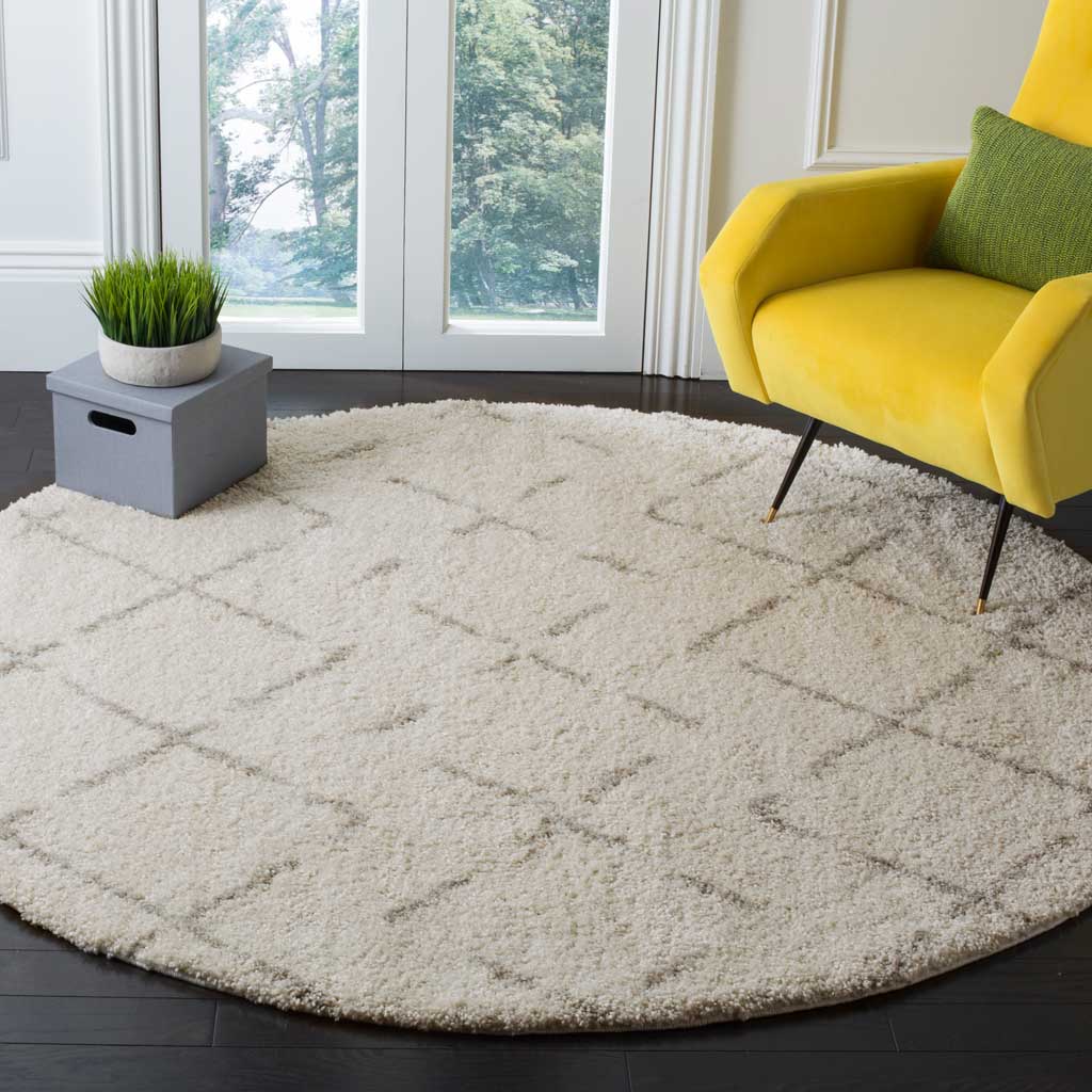 A subtle beige lattice adds quiet pattern to a soft ivory shag rug
