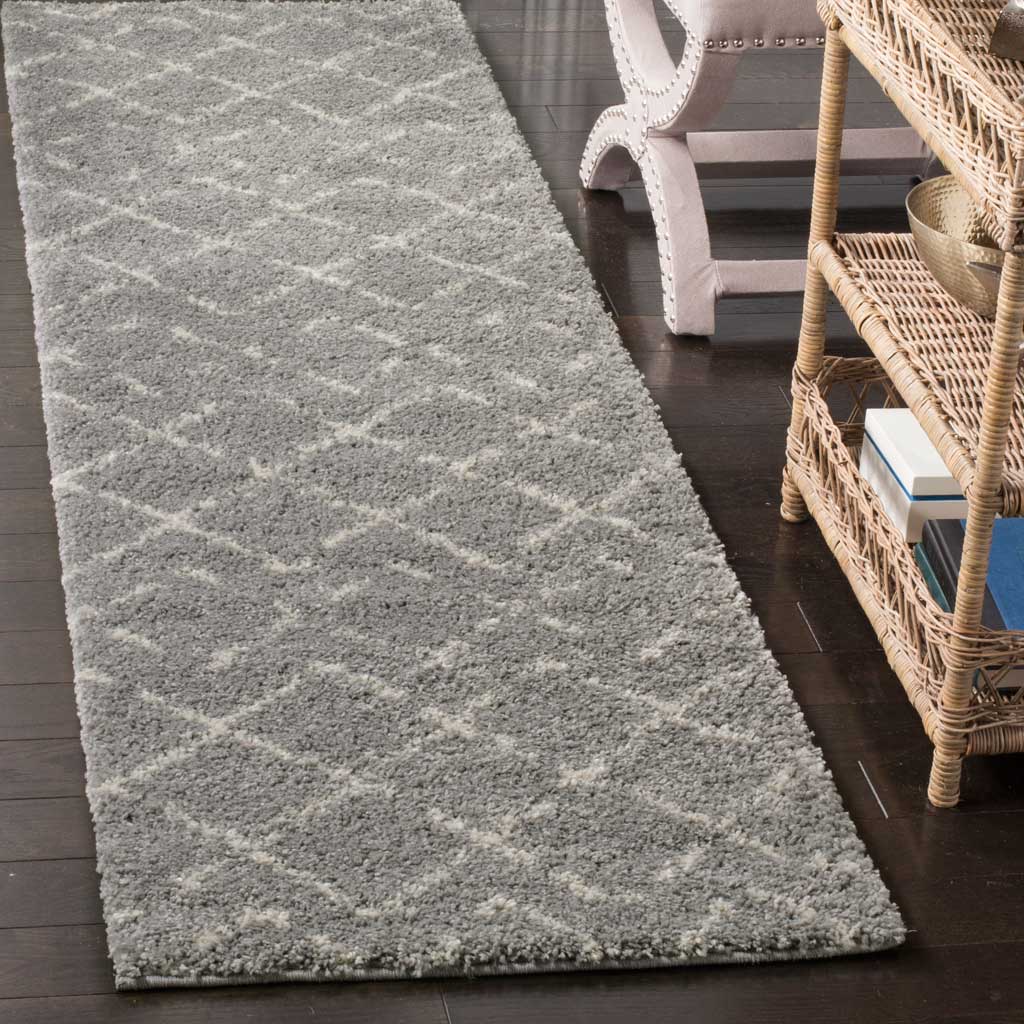 Thick gray shag brings cozy texture to a runner with a soft ivory diamond lattice.