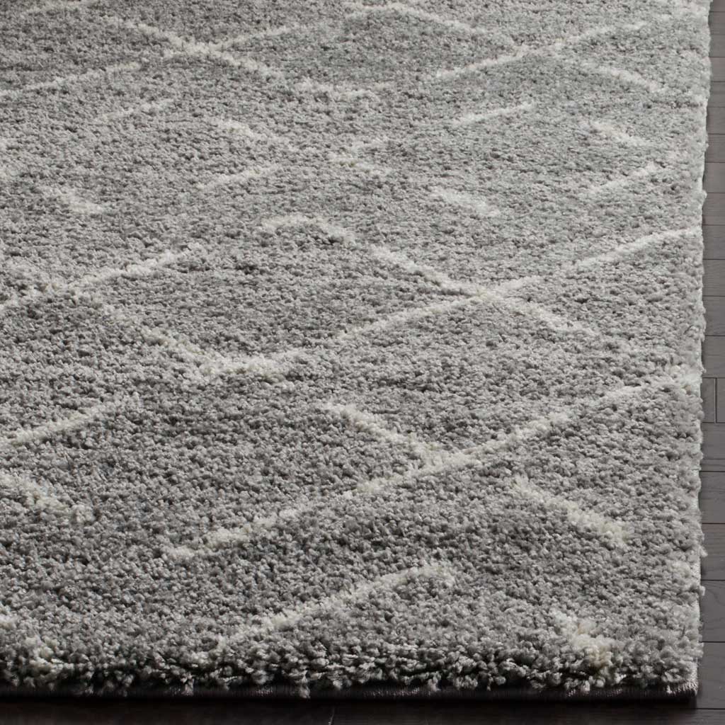 Dense gray fibers and broken ivory diagonals finish in a neatly bound corner.