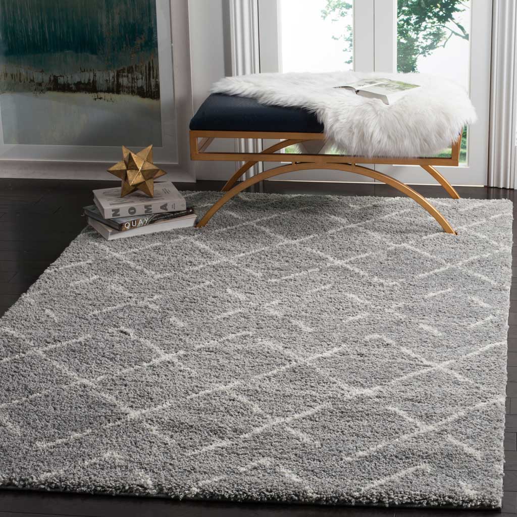 Gray and ivory diamond trellis adds gentle contrast and plush comfort beneath a bench.