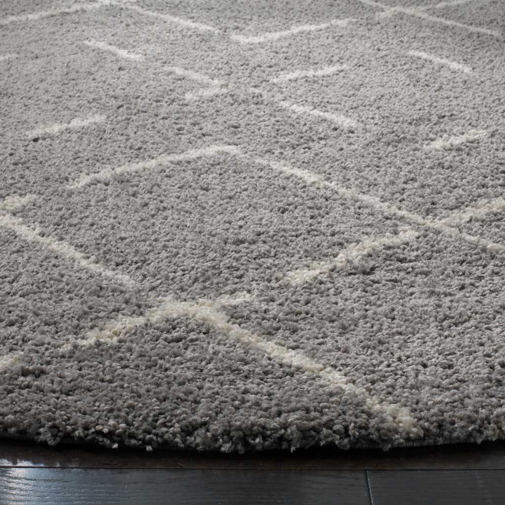 Deep gray shag pile and ivory lattice lines lend softness and quiet contrast