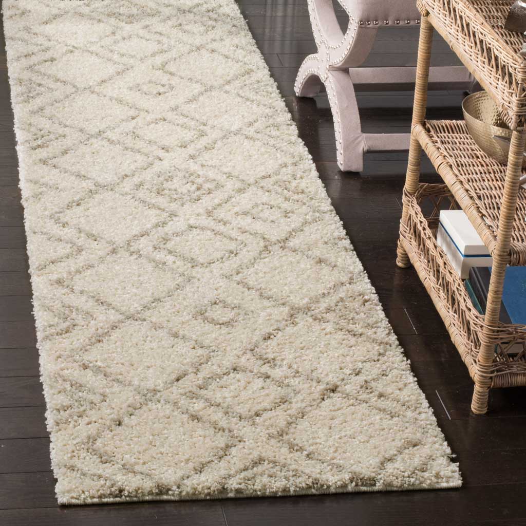Raised beige diamond lines add gentle definition to this soft ivory shag runner.