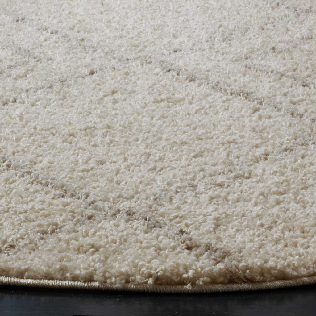 Dense ivory pile and subtle beige accents create a softly textured surface
