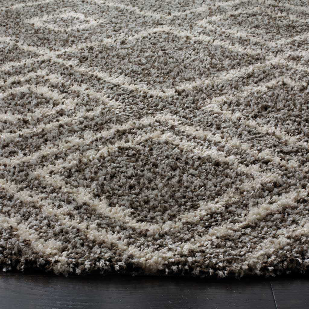 Dense brown and ivory shag pile adds cozy texture to the graphic square pattern