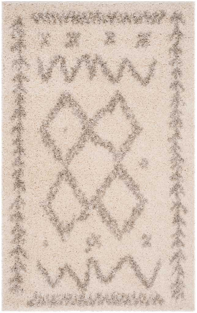 Small ivory rug displays a gray diamond cluster with zigzags and leafy edge accents.