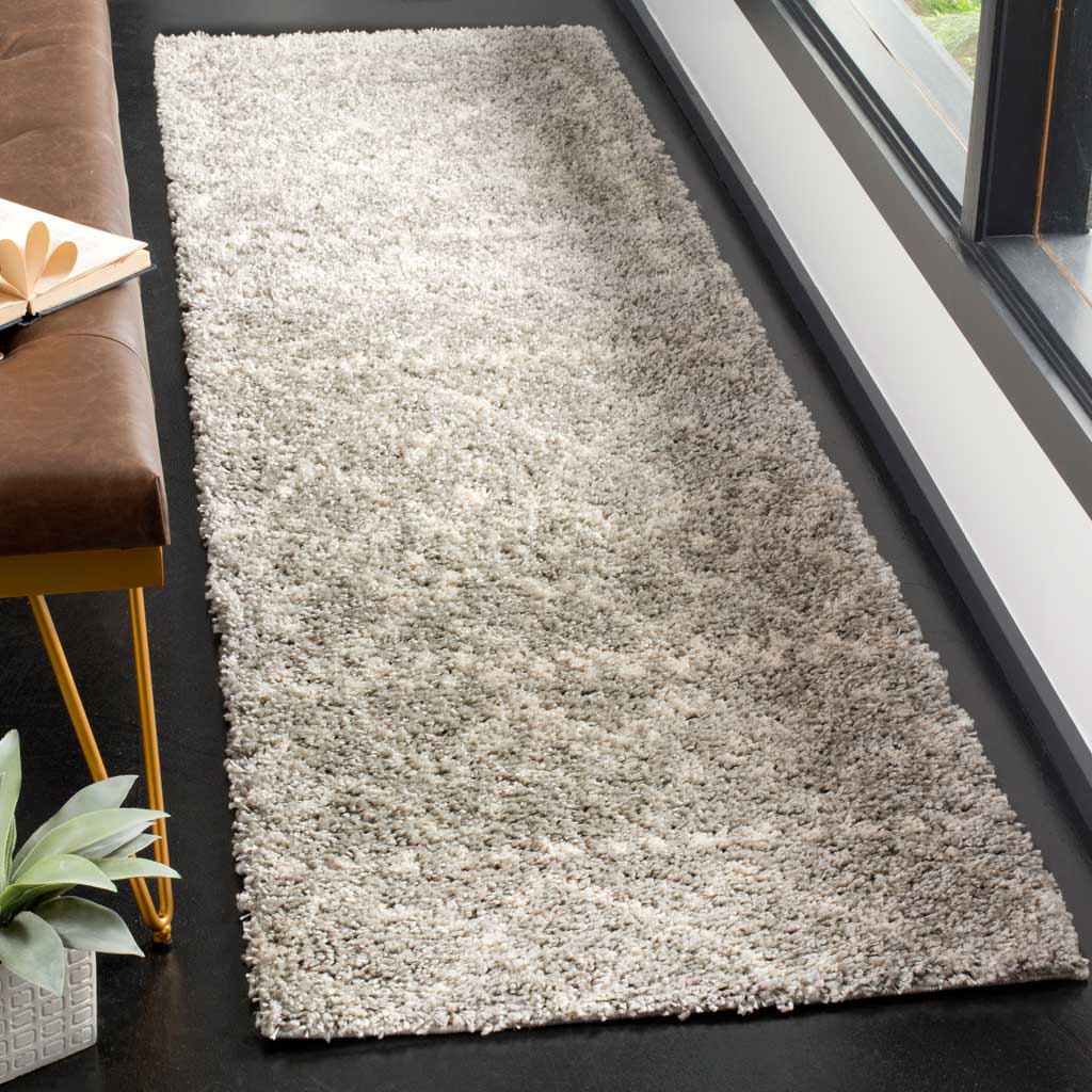 Thick gray and ivory pile softens this runner's layered geometric details.