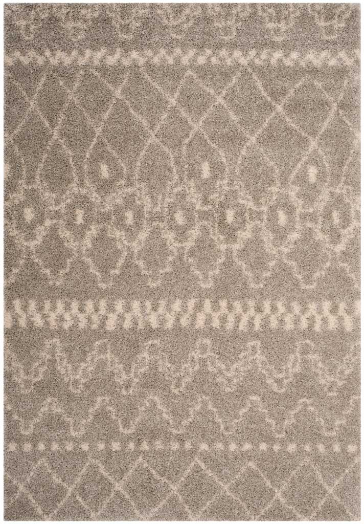 Gray shag rug interweaves ivory diamond rows, dotted bands, and ornamental shapes.