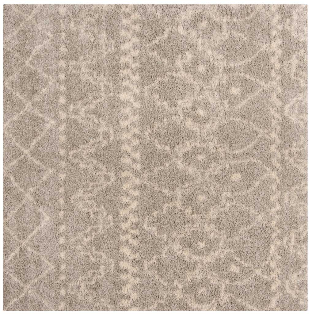 Square gray and ivory rug features softly defined diamonds and repeating ornamental motifs.
