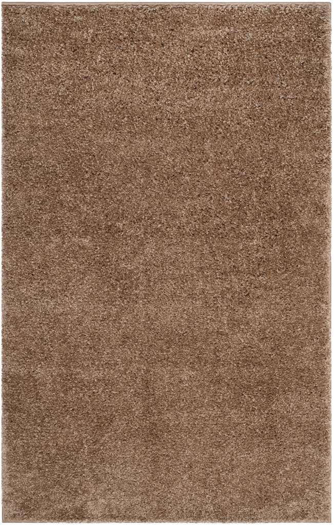 Small taupe shag rug adds soft texture and warm neutral color to a room.